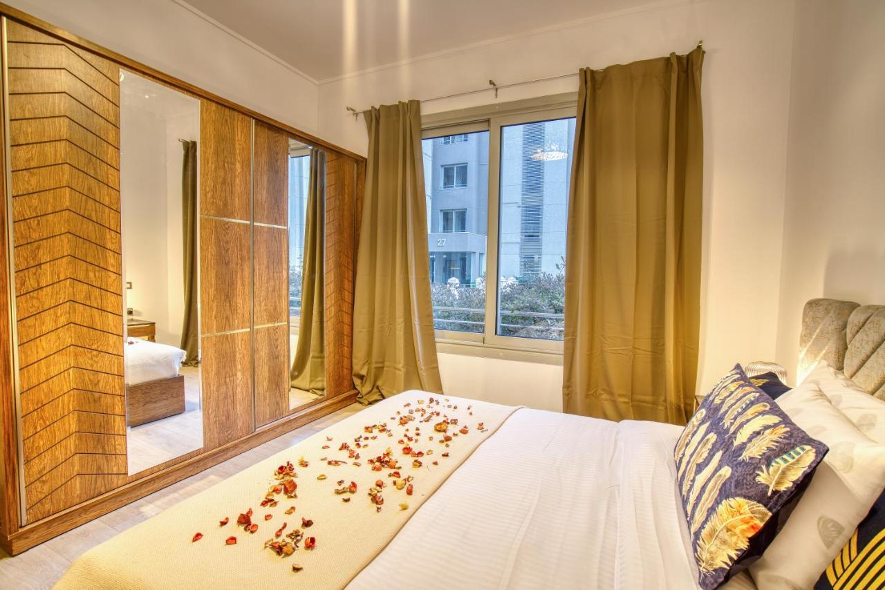 The Suites Near Auc By Elegant Каир Экстерьер фото
